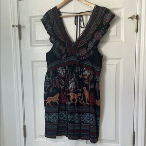 Anthropologie Black and Red Patterned dress. Large. Pockets. Tie back. Ruffle.